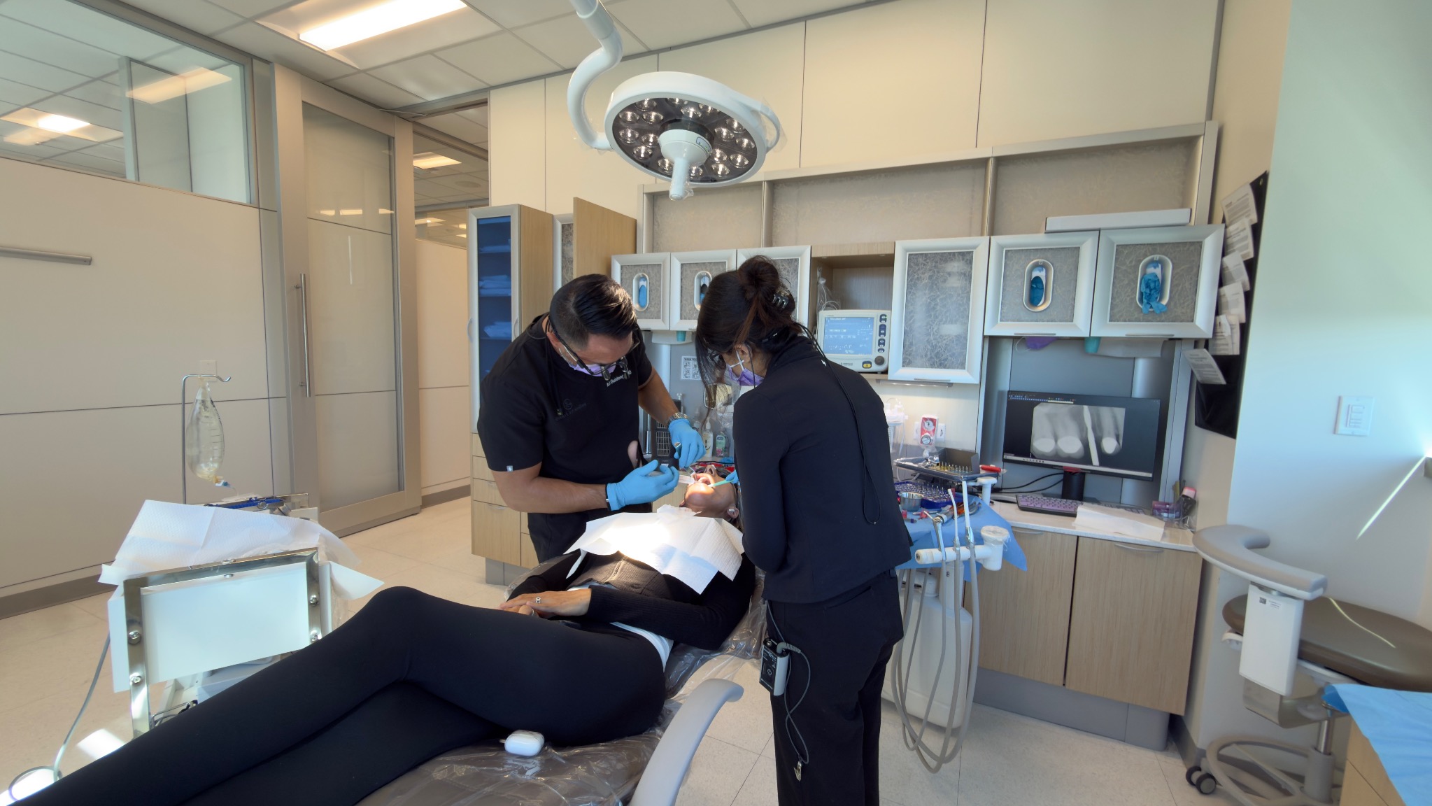 A wide view of Dr. R.J. and the clinical team